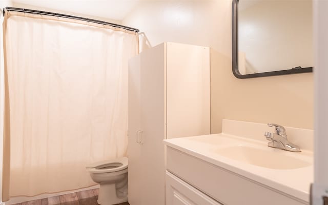 bathroom with vanity, a shower with curtain, hardwood / wood-style flooring, and toilet