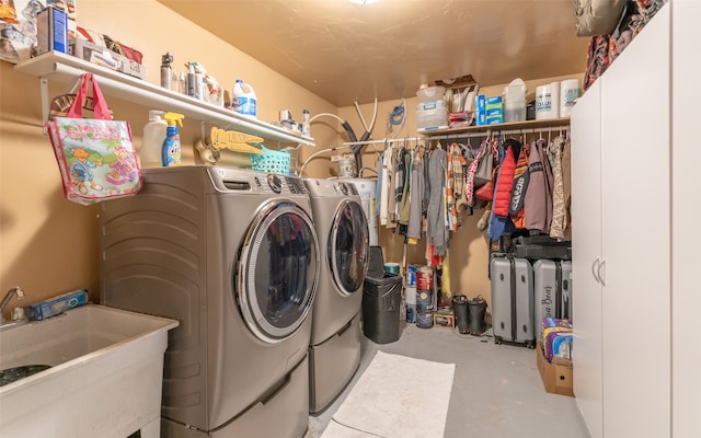 laundry area featuring sink and washer and dryer