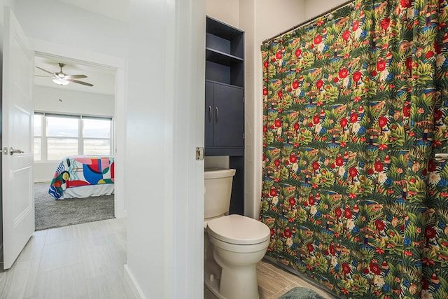 bathroom featuring toilet and a ceiling fan