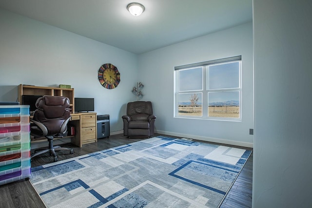 home office featuring dark wood finished floors and baseboards
