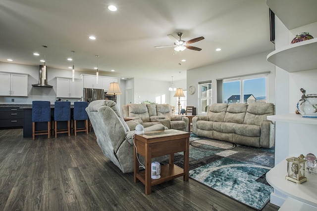 living area featuring dark wood-style floors, a ceiling fan, and recessed lighting