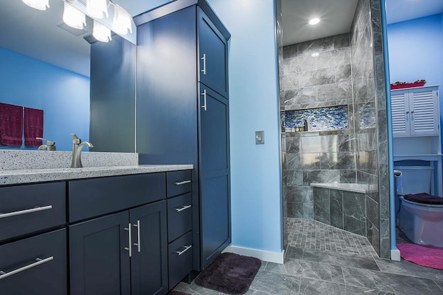 bathroom with baseboards, walk in shower, vanity, toilet, and recessed lighting