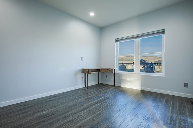 unfurnished room featuring dark hardwood / wood-style flooring