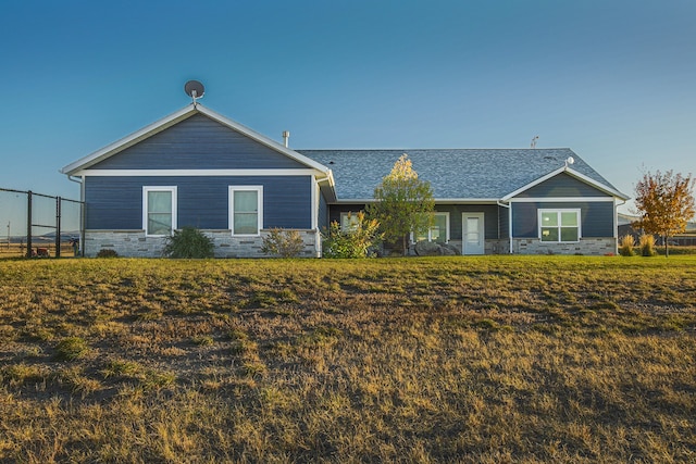 ranch-style house with a front yard