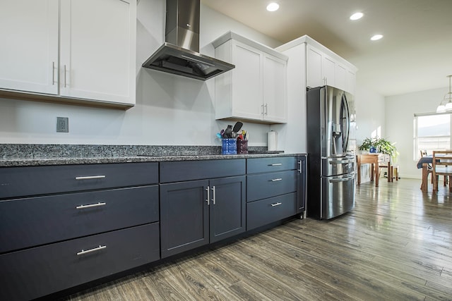 kitchen featuring ventilation hood, stainless steel fridge with ice dispenser, dark wood-type flooring, and white cabinets