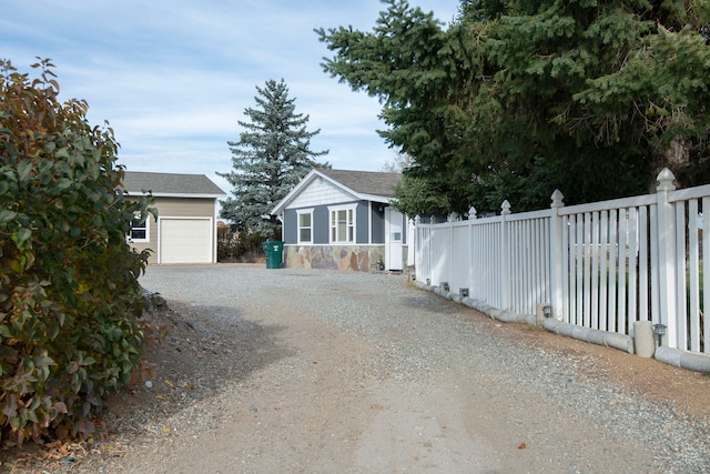 view of home's exterior with an outdoor structure