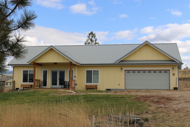 view of front of home with a front lawn and a garage