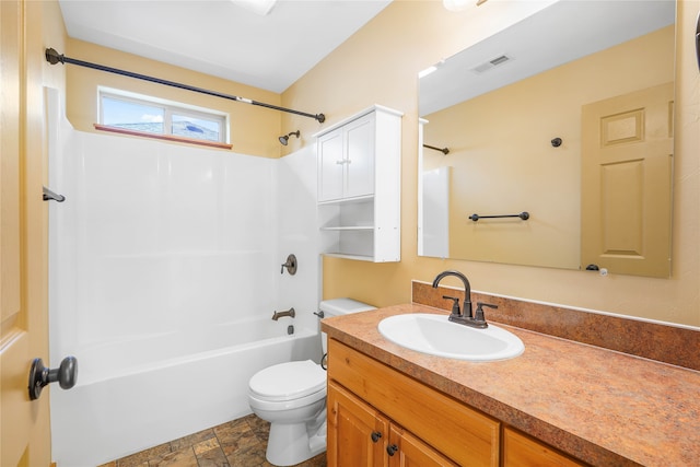 full bathroom featuring bathtub / shower combination, vanity, and toilet