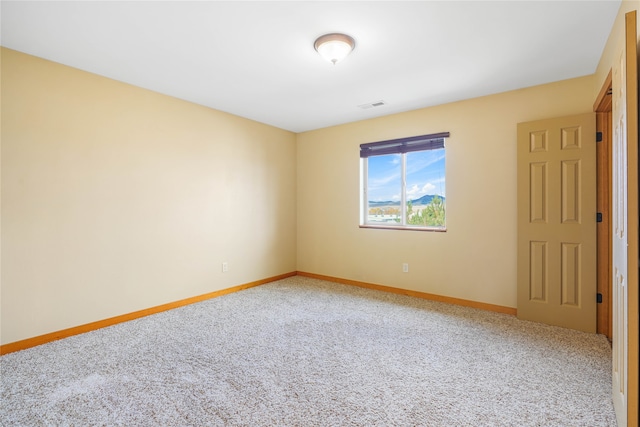 spare room featuring carpet flooring