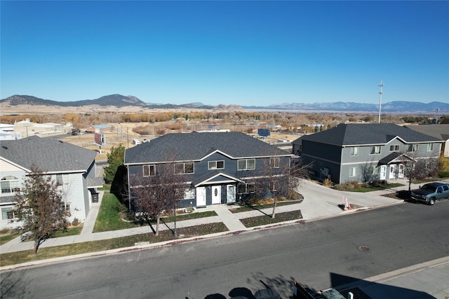 view of front of house featuring a garage and a mountain view