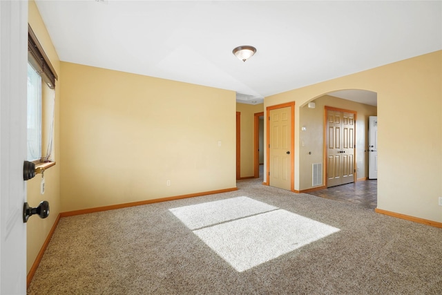 2726 Overlook Blvd, Helena, MT 59601 - empty room featuring carpet flooring and arched walkways