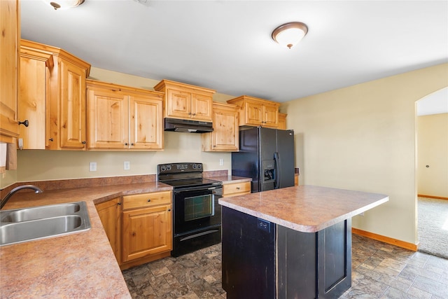 2726 Overlook Blvd, Helena, MT 59601 - kitchen featuring black appliances, stone finish floors, under cabinet range hood, and a kitchen island