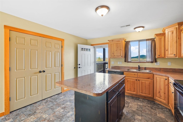 2726 Overlook Blvd, Helena, MT 59601 - kitchen featuring stone finish floors, black electric range, and a center island