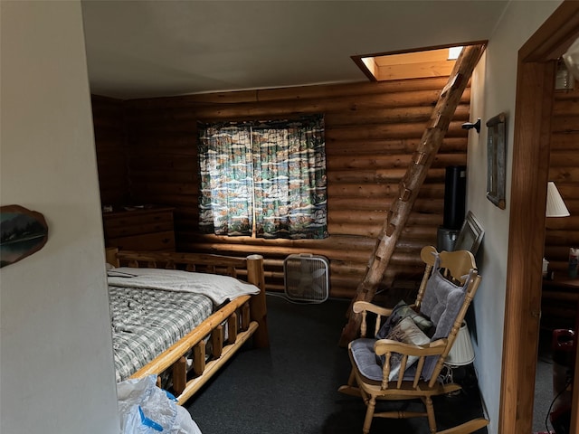 bedroom featuring log walls and a skylight