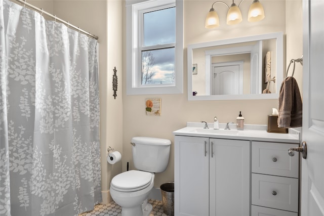 bathroom featuring vanity, toilet, and tile patterned floors