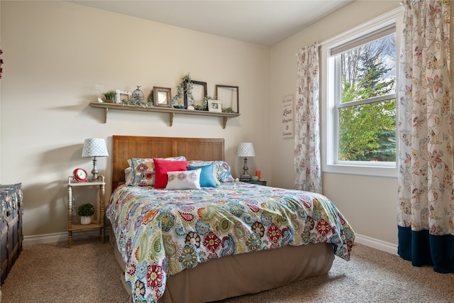 carpeted bedroom featuring multiple windows