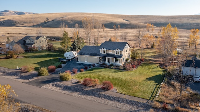 drone / aerial view with a mountain view and a rural view