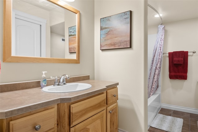 bathroom featuring vanity, shower / bath combo, and tile patterned flooring