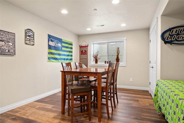 dining area featuring dark hardwood / wood-style flooring