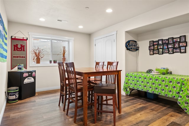 dining room with dark hardwood / wood-style floors