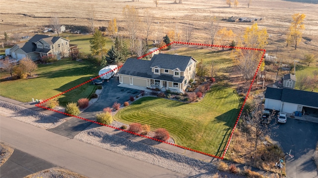 birds eye view of property with a rural view