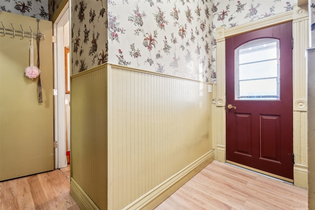 entryway with hardwood / wood-style floors