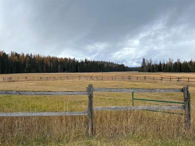 NHN Lupfer Meadows Rd, Whitefish, MT 59937 - view of yard featuring a rural view, fence, and a wooded view