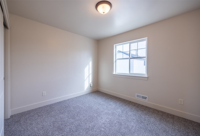 unfurnished room with carpet flooring