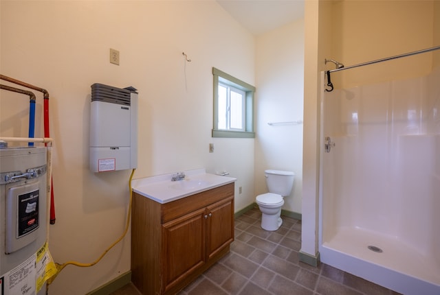 bathroom with vanity, toilet, electric water heater, and walk in shower