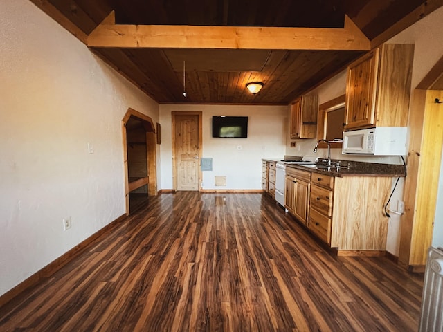 9330 US Highway 2 W, Marion, MT 59925 - kitchen with wood ceiling, dark countertops, dark wood-style floors, baseboards, and arched walkways