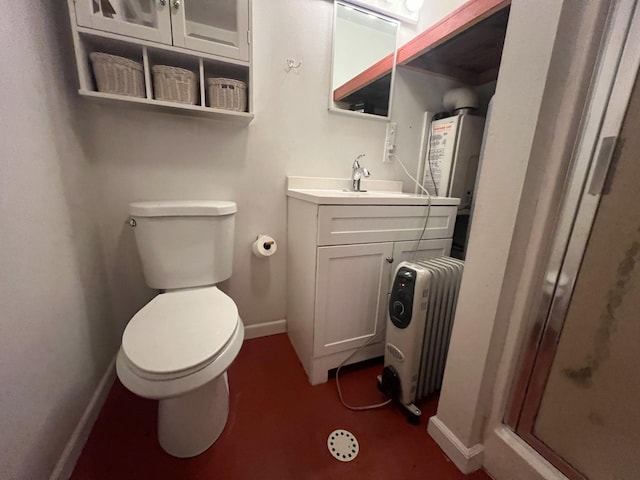 9330 US Highway 2 W, Marion, MT 59925 - bathroom featuring radiator heating unit, toilet, vanity, a shower stall, and baseboards