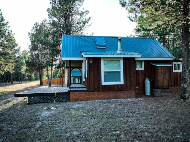 9330 US Highway 2 W, Marion, MT 59925 - rear view of house with metal roof and a deck