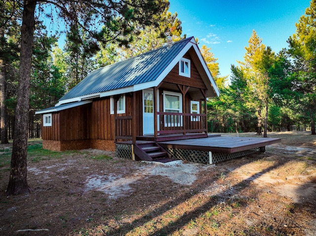 9330 US Highway 2 W, Marion, MT 59925 - view of front of home with metal roof, board and batten siding, and a deck