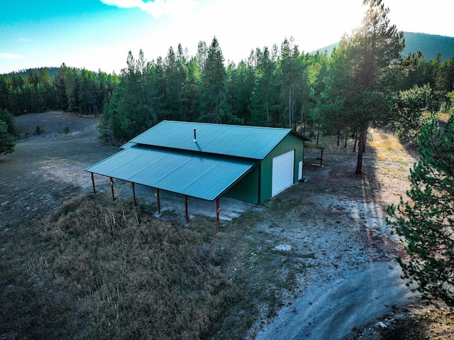 9330 US Highway 2 W, Marion, MT 59925 - view of outdoor structure featuring a view of trees and driveway