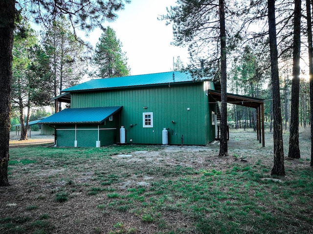 9330 US Highway 2 W, Marion, MT 59925 - view of side of property featuring metal roof, a pole building, and an outbuilding