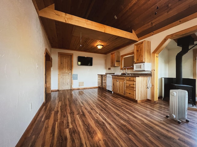 9330 US Highway 2 W, Marion, MT 59925 - kitchen featuring wooden ceiling with exposed beams, white microwave, radiator heating unit, dark wood-type flooring, and dark countertops