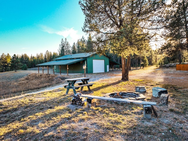 9330 US Highway 2 W, Marion, MT 59925 - view of yard with an outdoor structure, a pole building, a detached garage, and driveway