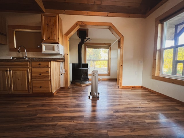 9330 US Highway 2 W, Marion, MT 59925 - kitchen featuring white microwave, a sink, dark wood-style floors, and healthy amount of natural light