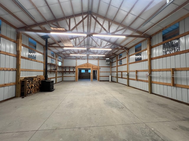 9330 US Highway 2 W, Marion, MT 59925 - garage with metal wall, a wood stove, and a wall unit AC