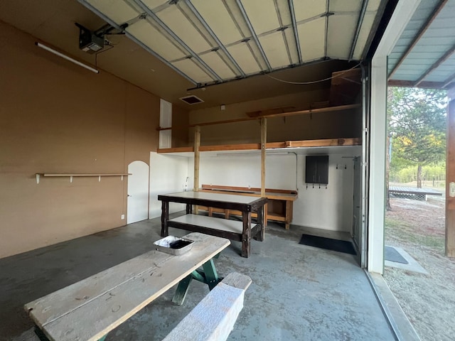 9330 US Highway 2 W, Marion, MT 59925 - garage with a garage door opener and a workshop area