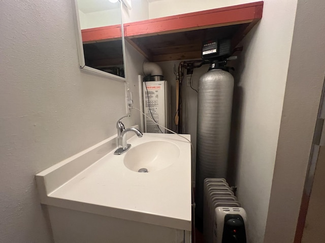 9330 US Highway 2 W, Marion, MT 59925 - bathroom with a textured wall, water heater, and vanity