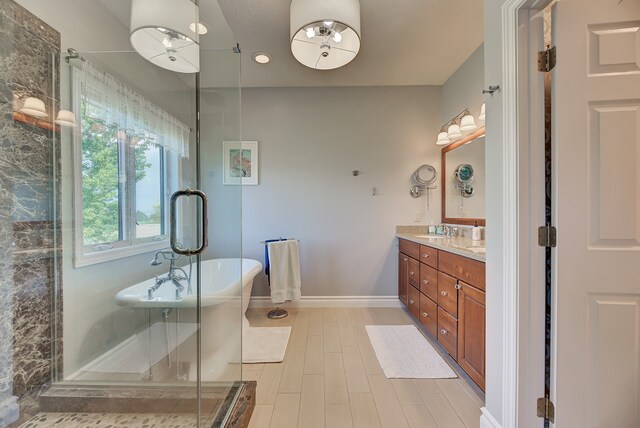 bathroom with vanity, hardwood / wood-style floors, and shower with separate bathtub