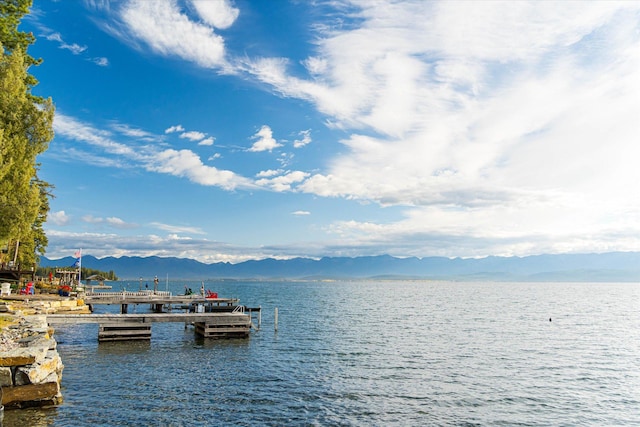 dock area featuring a water and mountain view