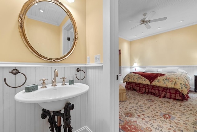 381 Lakeside Blvd, Lakeside, MT 59922 - ensuite bathroom with wainscoting, crown molding, a ceiling fan, and a decorative wall