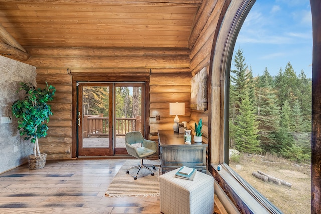 unfurnished sunroom featuring wood ceiling and lofted ceiling