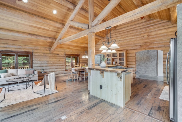 1750 Hill Meadows Rd, Whitefish, MT 59937 - kitchen featuring wooden ceiling, open floor plan, a chandelier, freestanding refrigerator, and healthy amount of natural light