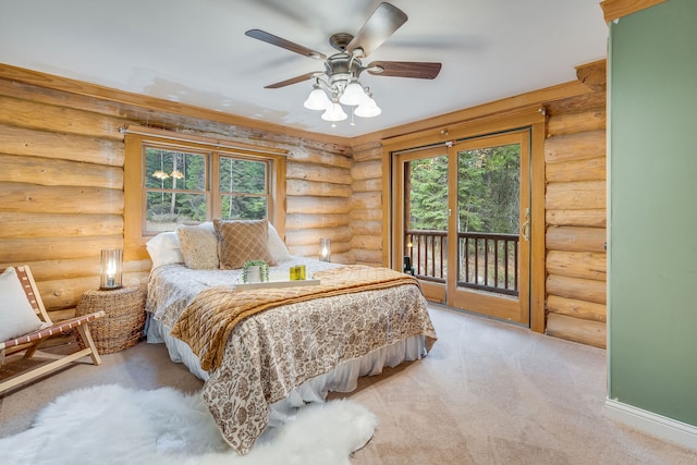 bedroom with access to exterior, rustic walls, light carpet, and multiple windows