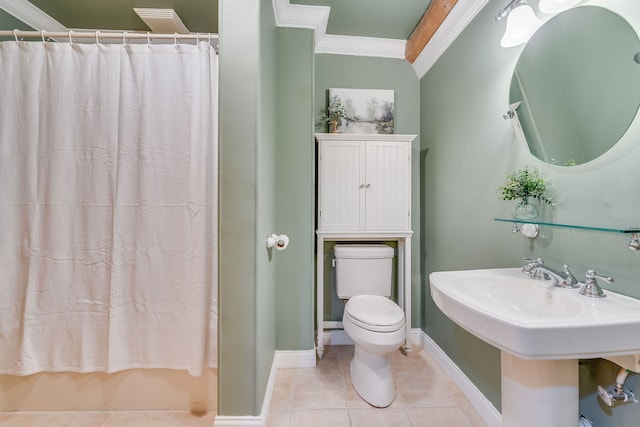 bathroom featuring crown molding, toilet, tile patterned flooring, and a shower with shower curtain