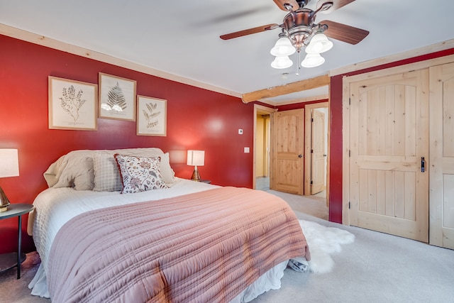 bedroom featuring light colored carpet and ceiling fan