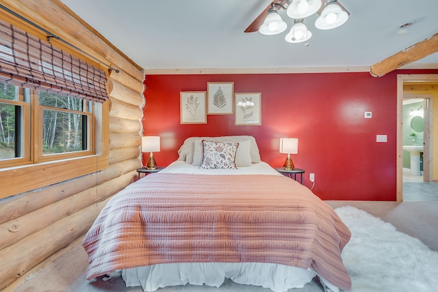 carpeted bedroom with sink, rustic walls, and ceiling fan